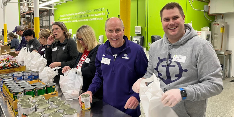 Alumni volunteering at a food bank