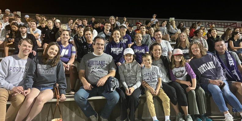 Alumni and friends at men's soccer away game in Denver