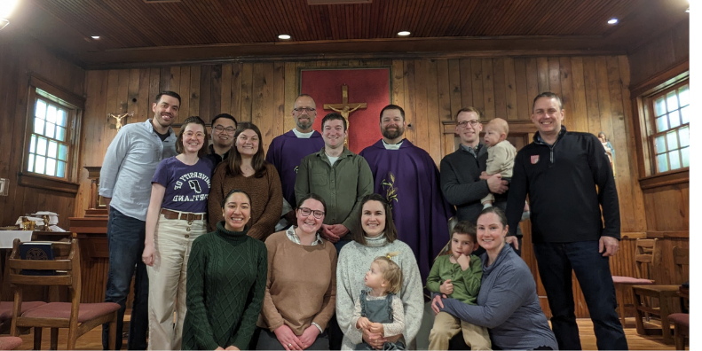 alumni in the historic log chapel at Notre Dame
