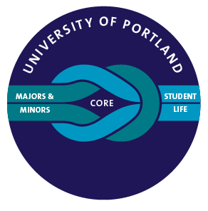 Two students at desks in classroom