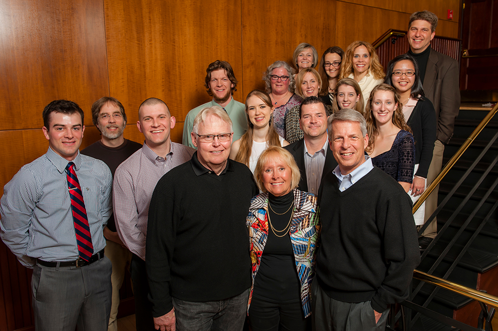 Amy Dundon-Berchtold and Jim Berchtold surrounded by students
