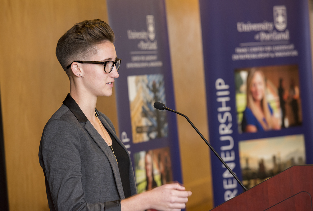 A person speaks at a podium