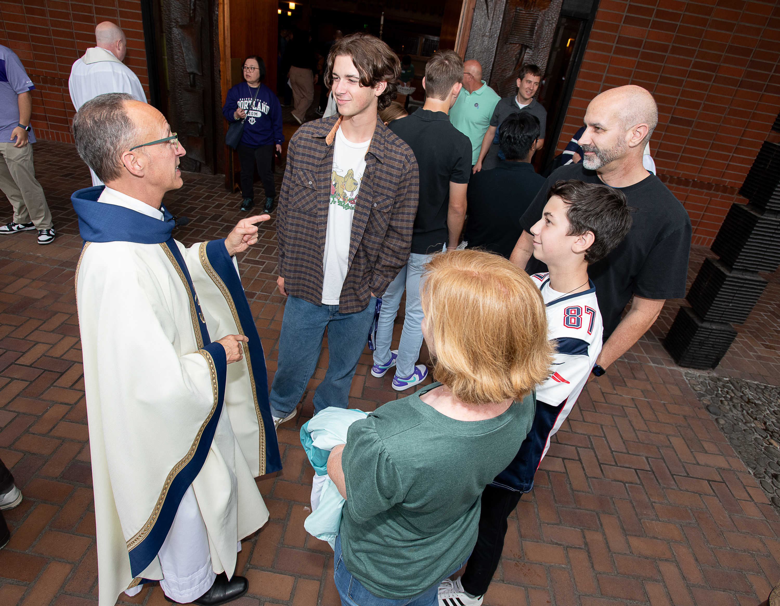 Priest with families