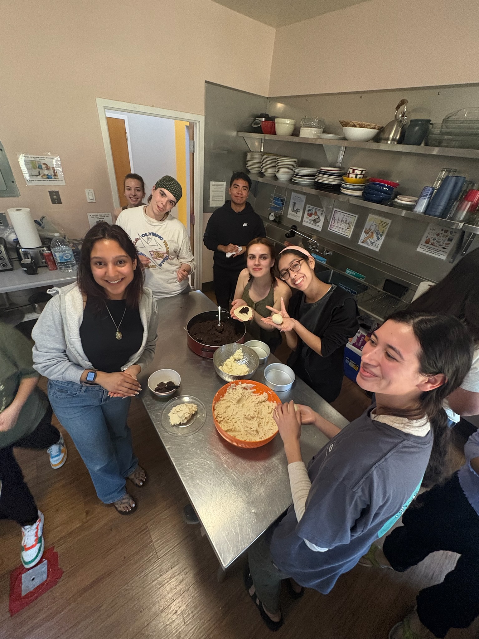 Participants in kitchen preparing food