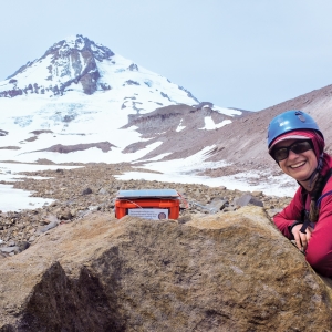Kiya Riverman smiles into the camera with Mt. Hood in the back