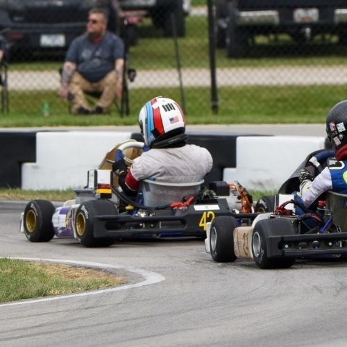 The UP team electric vehicle rounds the track during a race.
