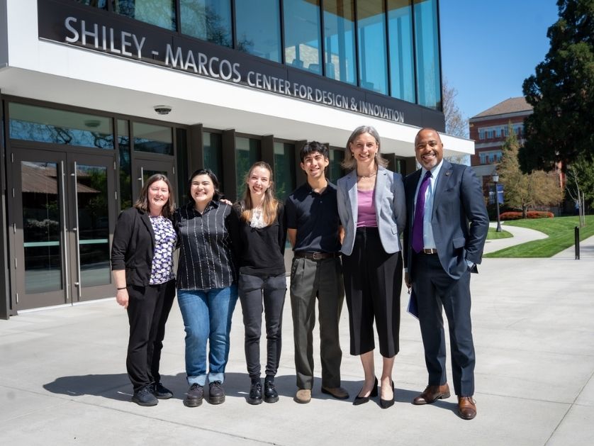 Congresswoman Maxine Dexter with members of the University of Portland community, including President Robert Kelly, standing outside the Shiley Marcos Center for Design and Innovation