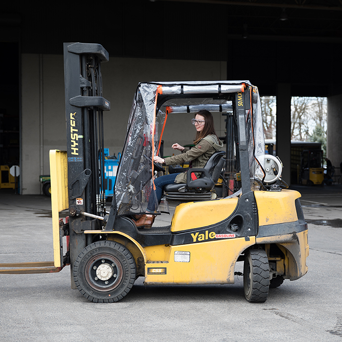 student on forklift
