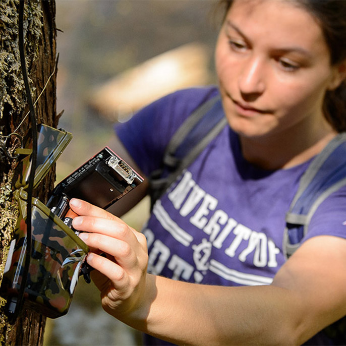 Student with research equipment