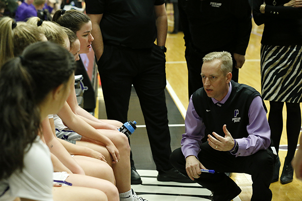 Michael Meek courtside during a timeout