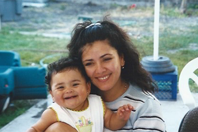 Mother holding smiling baby