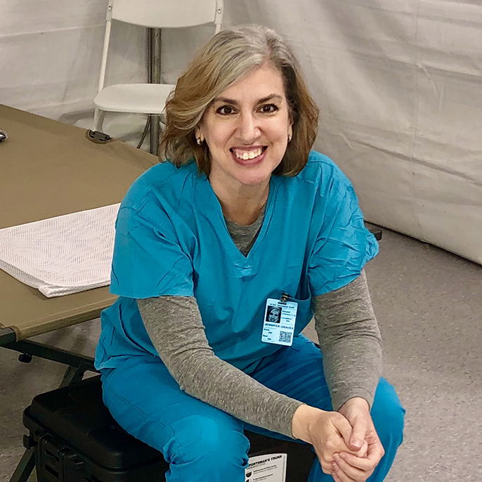 Jennifer Graves sitting on hospital cot