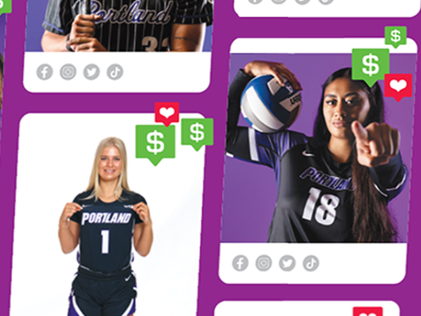 A close-in image of UP Basketball player Tyler Robertson is seated on a sport court bench surrounded by children as he autographs a t-shirt.