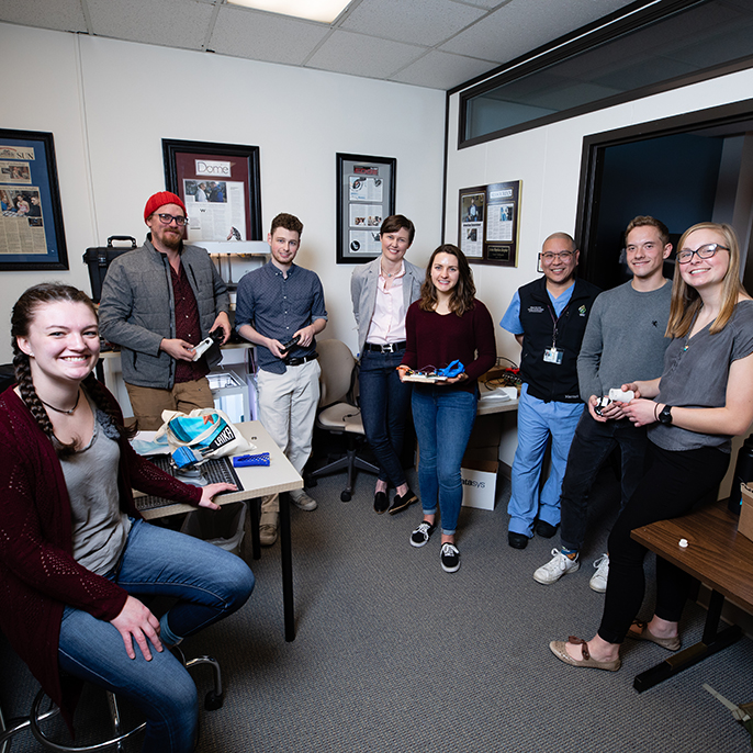 Shiley School of Engineering students with OHSU's Dr. Chi in lab