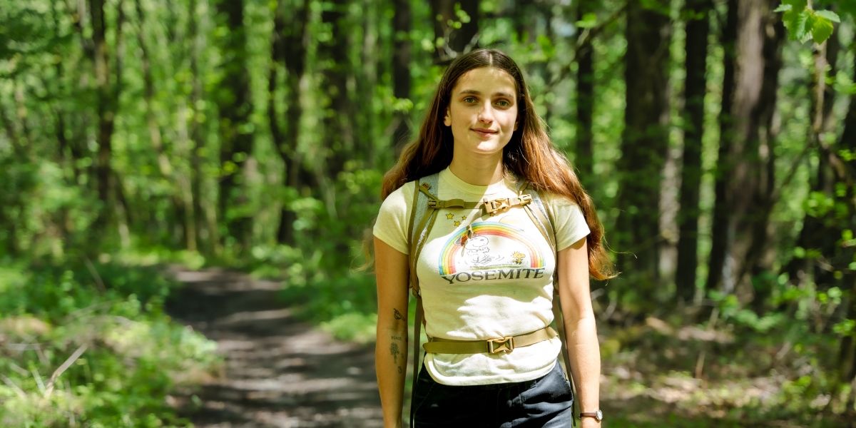 Lauren Banks stands among the trees and ferns in the Oregon forest while on a mushroom foraging hike.