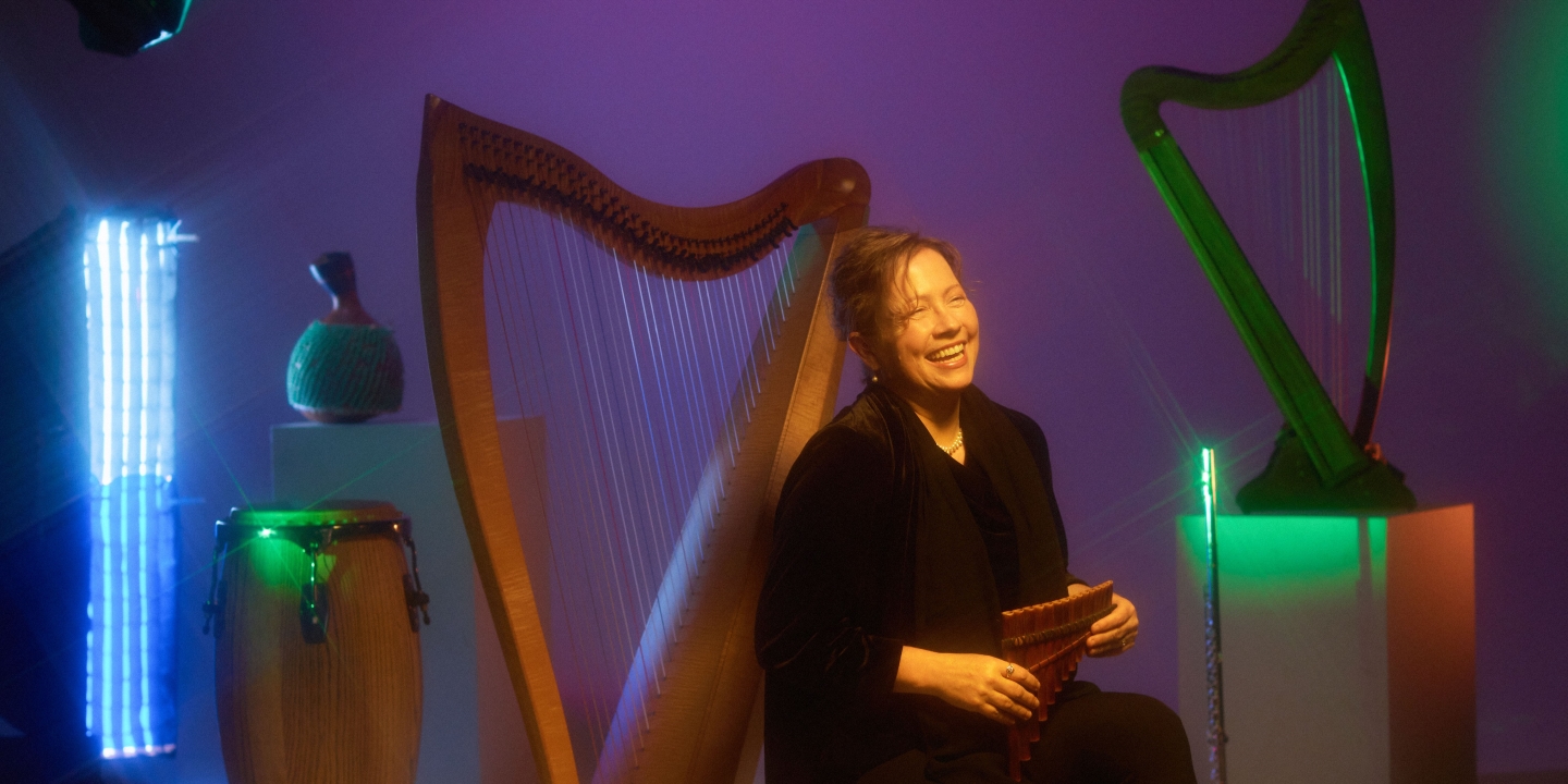 Mo Briare surrounded by harps