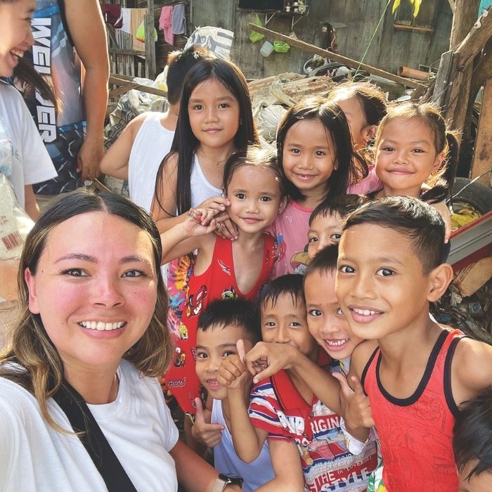 Mary Lea Bordelon with kids in the Philippines