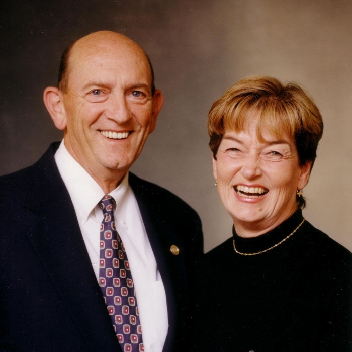 Al and Sue Corrado smiling in a couple portrait