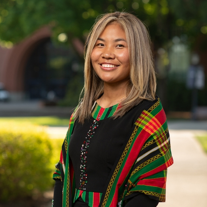 A portrait of Lucy smiling 