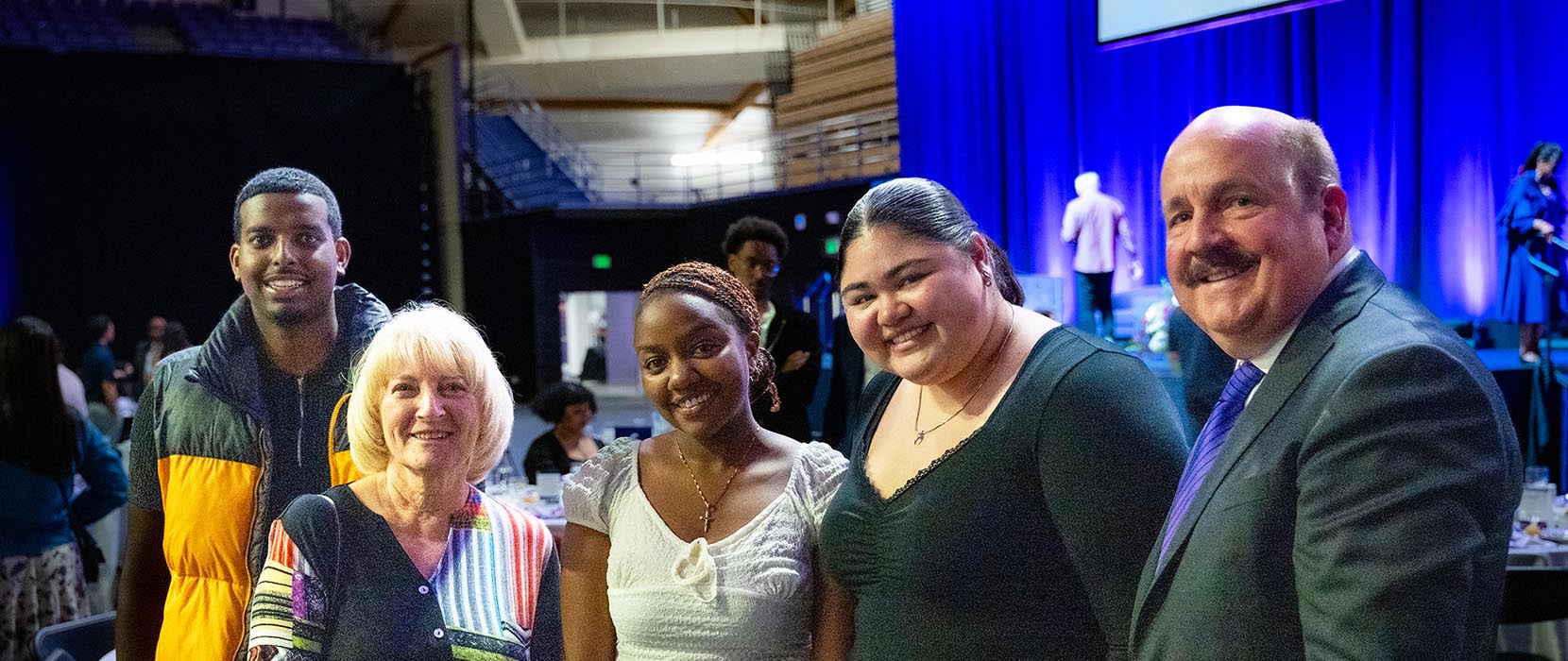 a group of people posing for a photo at an event