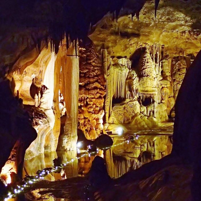 The interior of a cave illuminated with twinkling lights