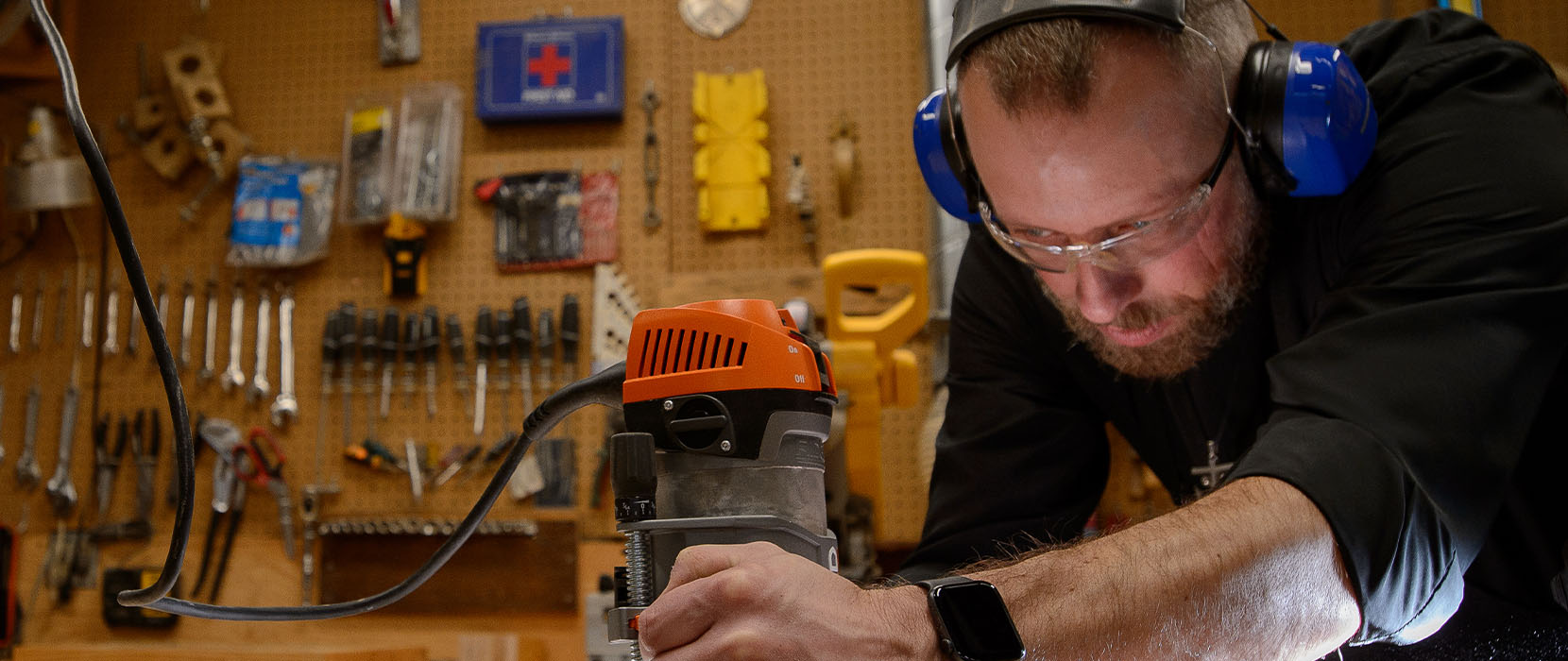 Fr. Dan works in the Holy Cross Court woodshed.