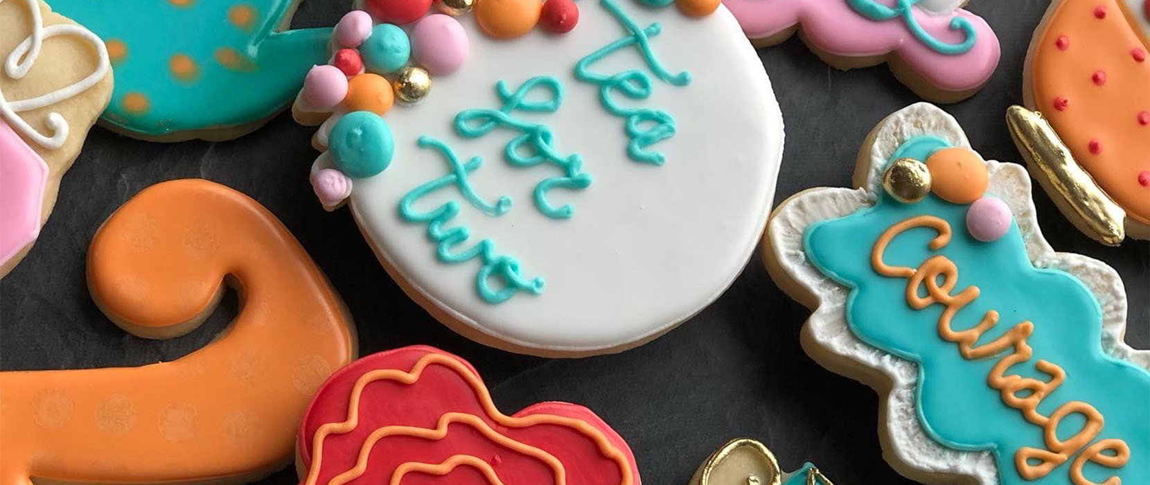 brightly colored cookies and the words 'tea for two