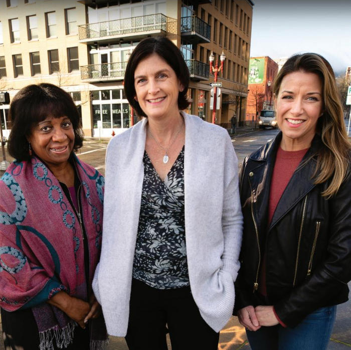 Kay Toran, Kelly Fox, and Emily Harrington in front of Blanchet House of Hospitality