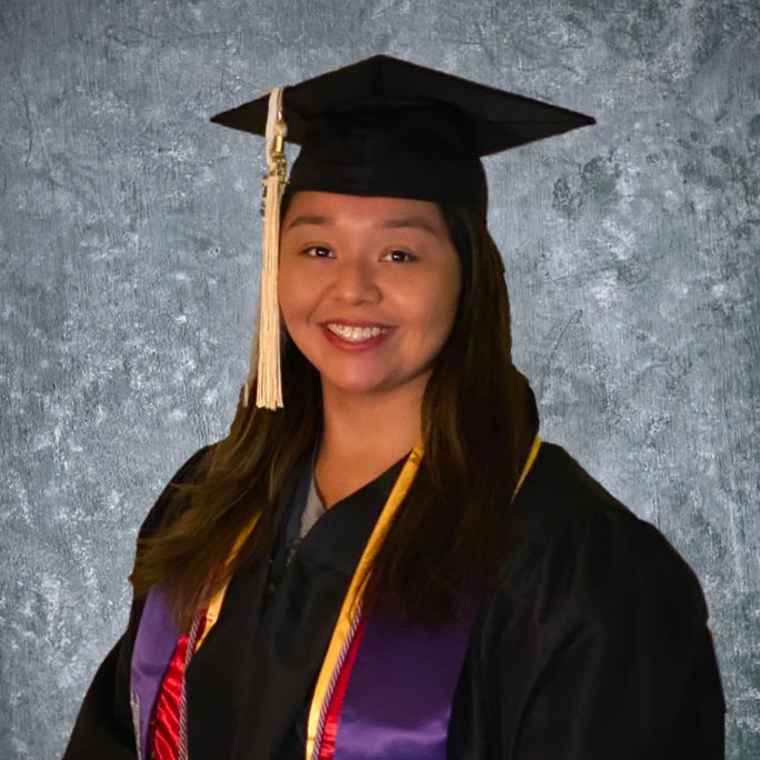 Devonna wears a cap and gown.