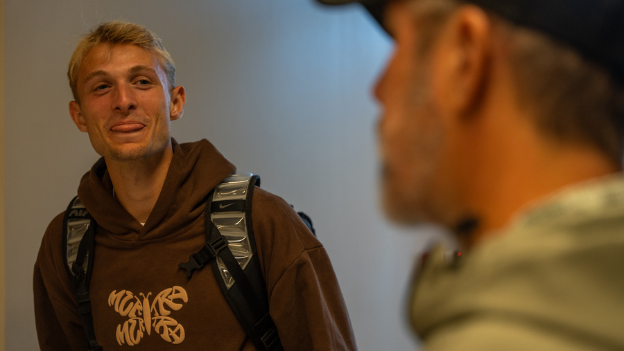 Photo of student talking to blurred out mentor.