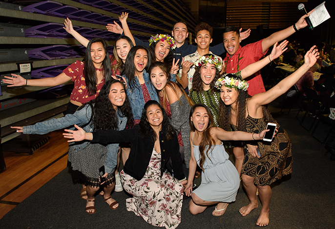 six students with arms around each other